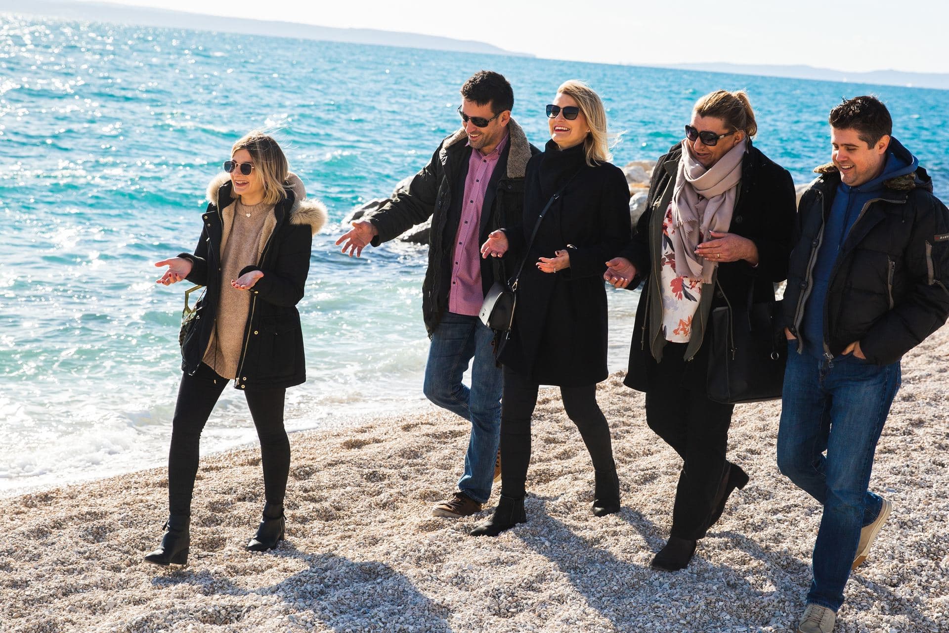 Participants walking on a beach in Split