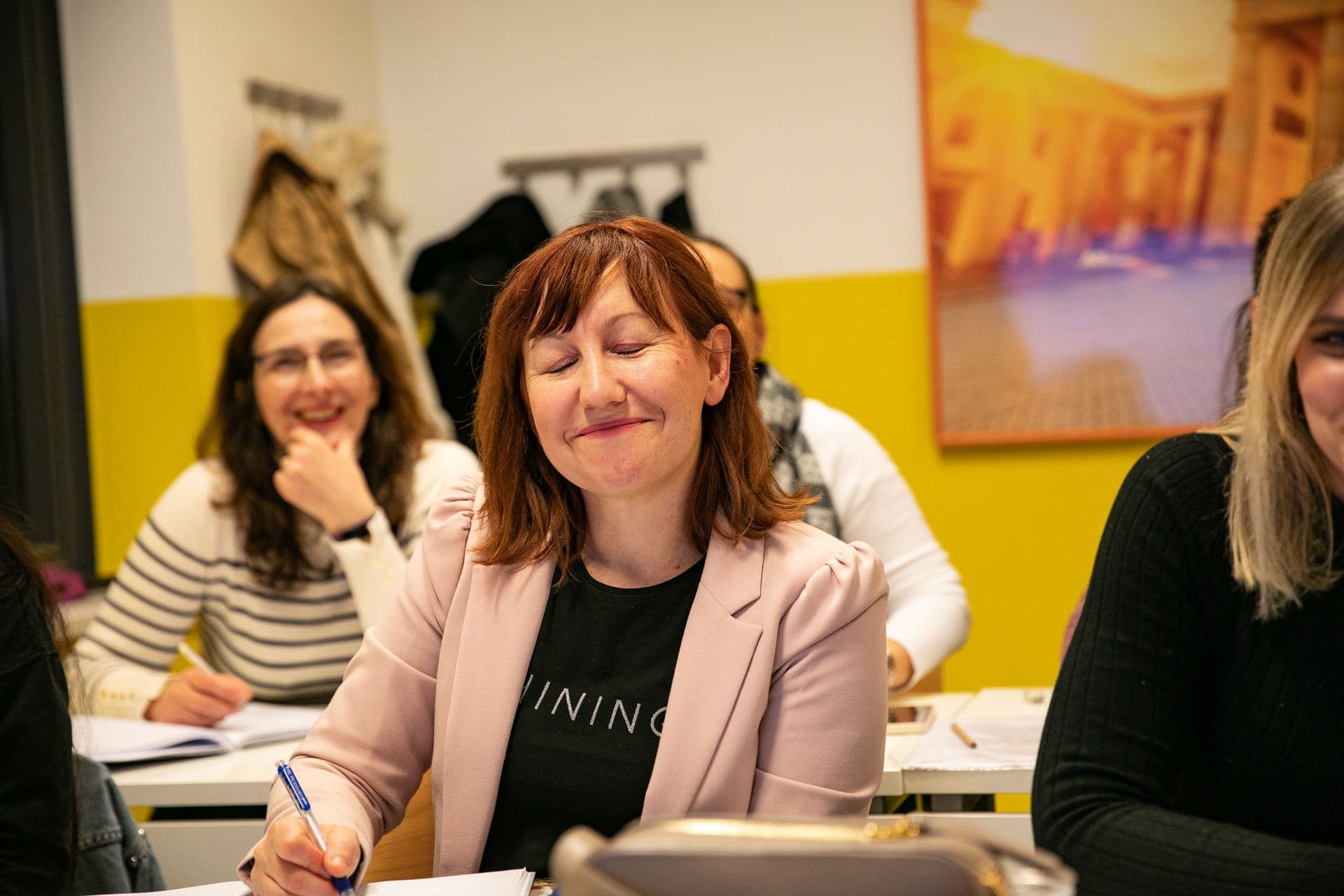 Teachers smiling during an English lesson