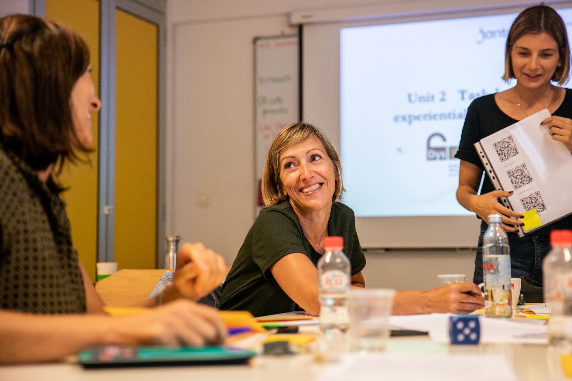Teachers working at a table during a session